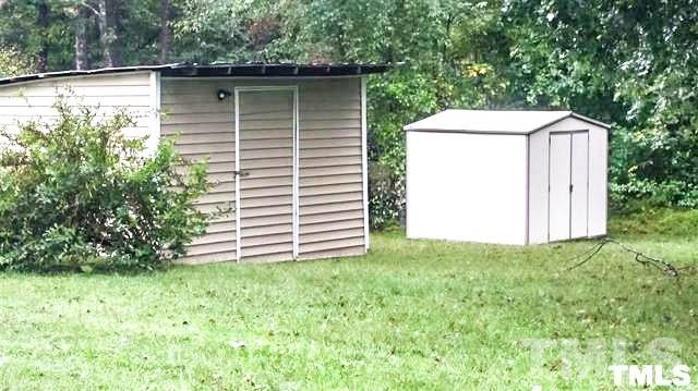 3026 Hamlin Road Durham, NC 27704 - Photo 15 of 15 Backyard workshop with electricity and a separate storage shed.