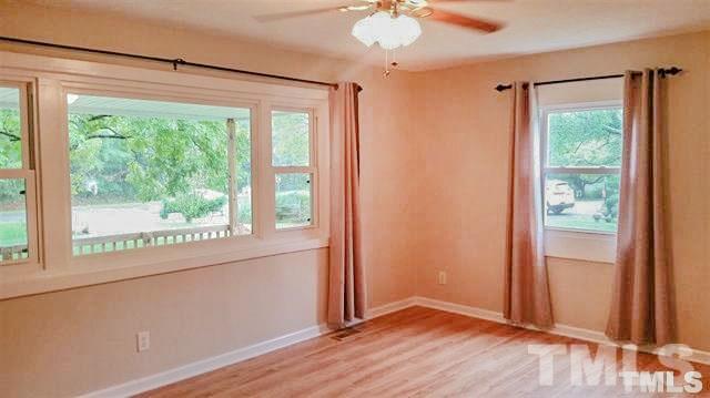 3026 Hamlin Road Durham, NC 27704 - Photo 4 of 15 The Living Room offers endless possibilities for arranging furniture with so much wall space, yet still plenty of beautiful views with large picture windows!