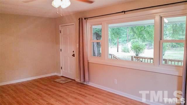 3026 Hamlin Road Durham, NC 27704 - Photo 5 of 15 Welcome guests into the 250+sqft Living Room and enjoy the views from the huge picture windows!