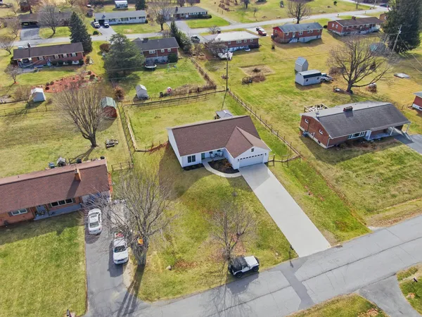 an aerial view of residential houses with outdoor space