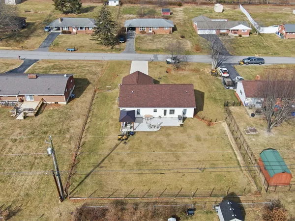 an aerial view of residential houses with outdoor space