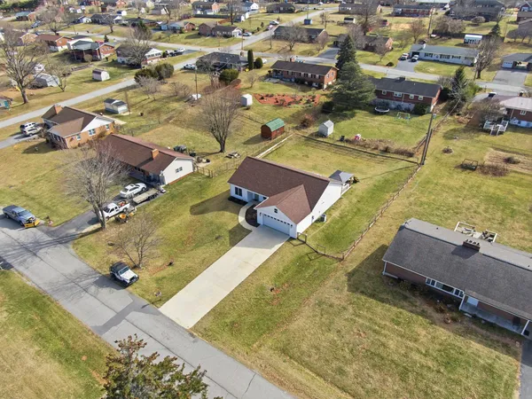 an aerial view of residential building and trees