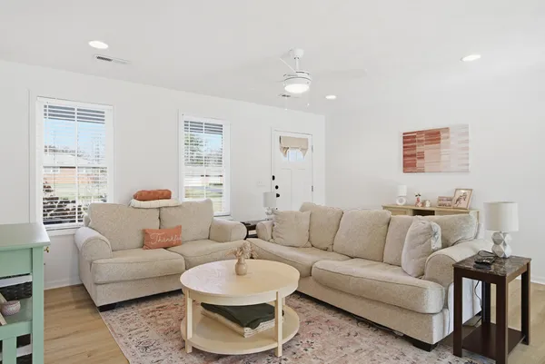 a living room with furniture and a large window