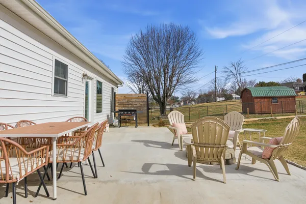 a front view of house with yard and seating area