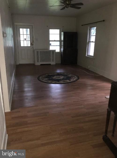 1267 Glassboro Road Williamstown, NJ 08094 - Photo 2 of 8 an empty room with wooden floor and windows