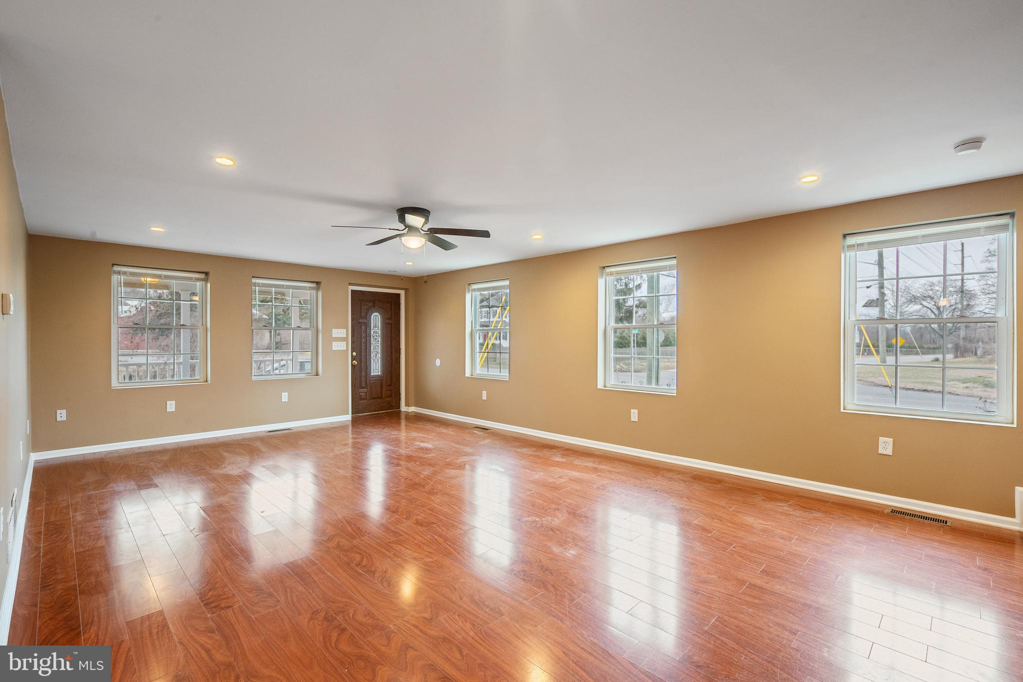 266 Bakers Basin Road Lawrence Township, NJ 08648 - Photo 14 of 32 a view of an empty room with wooden floor and a window