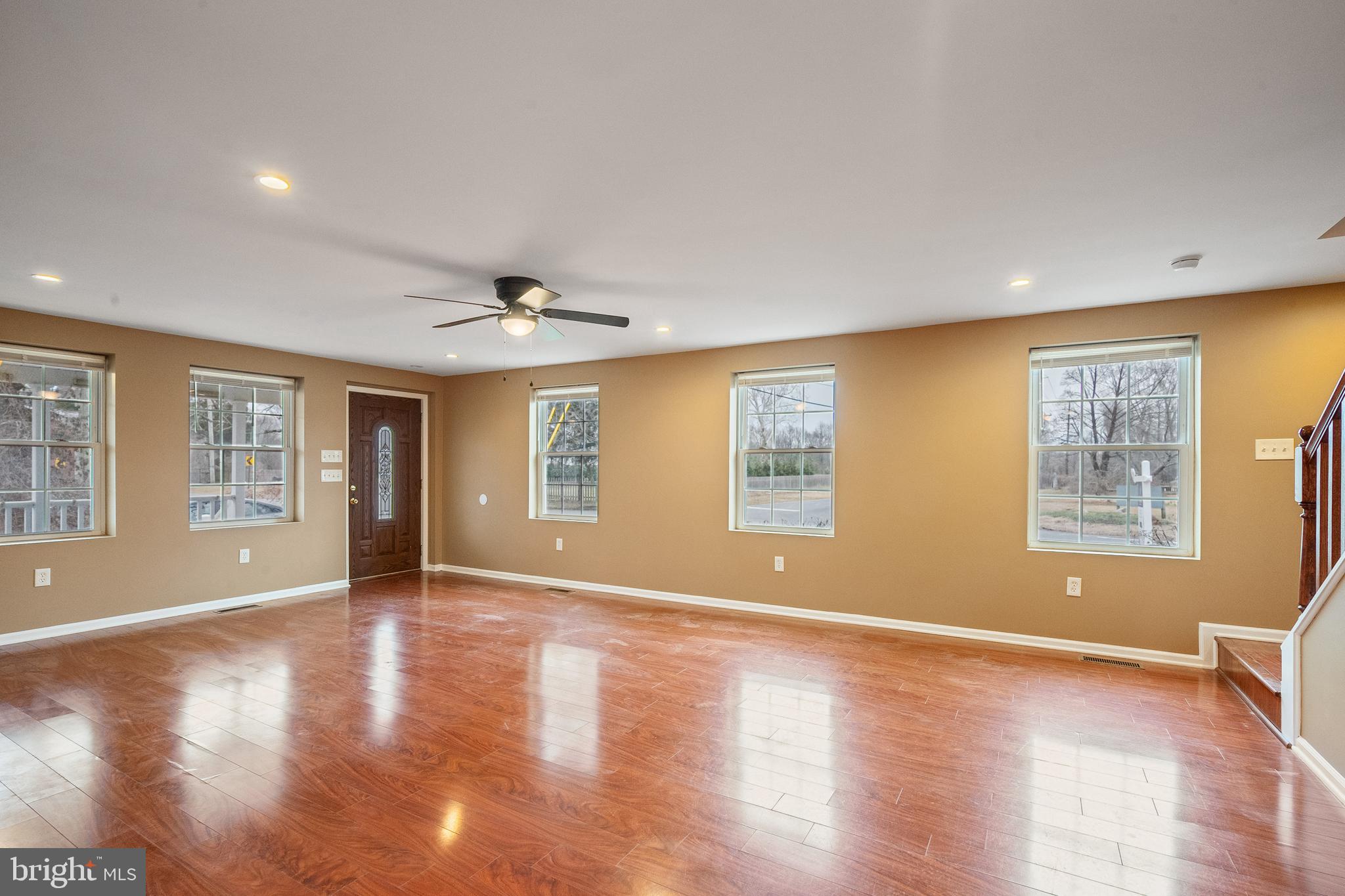 266 Bakers Basin Road Lawrence Township, NJ 08648 - Photo 15 of 32 a view of an empty room with wooden floor and a window