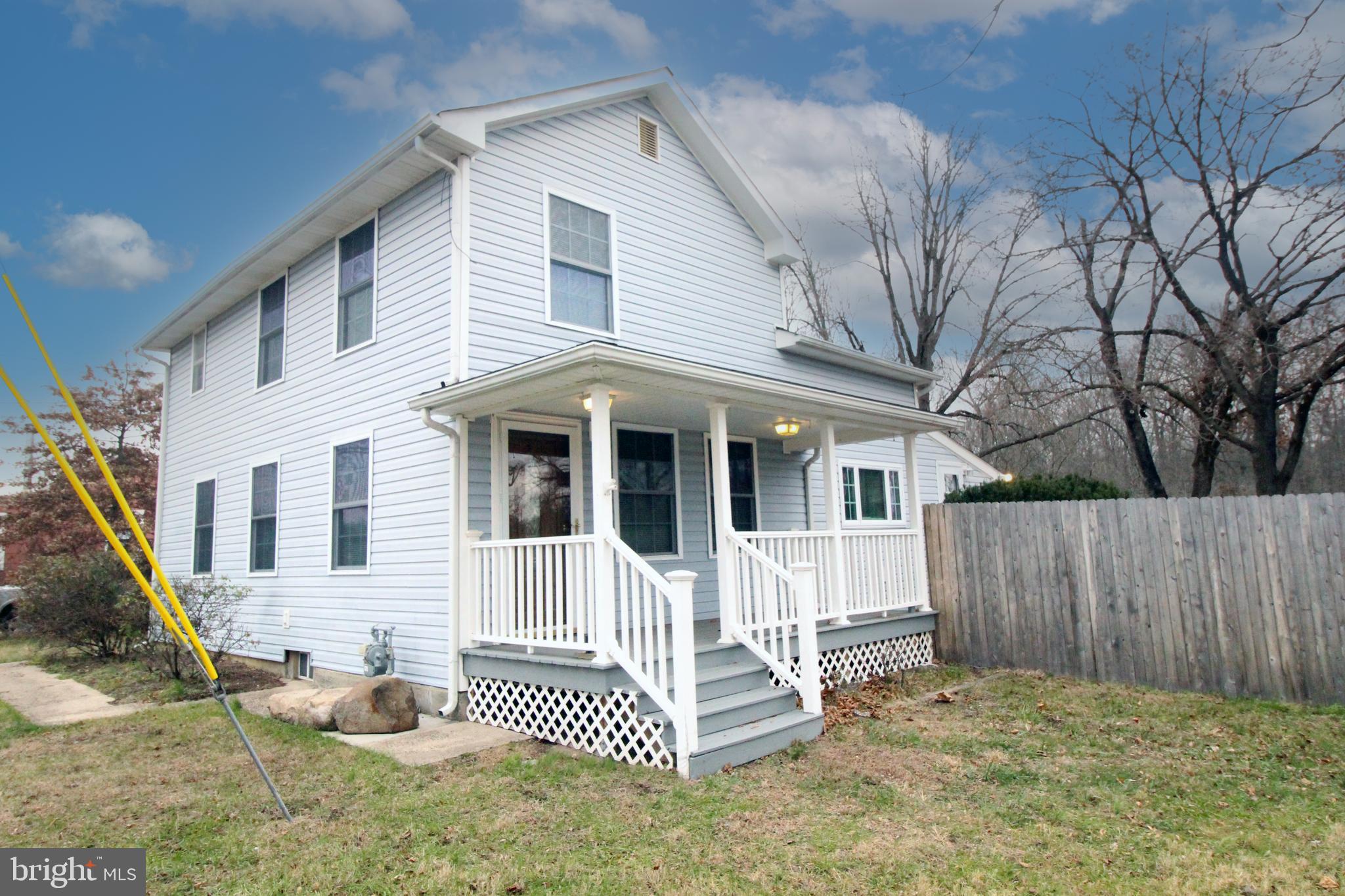 266 Bakers Basin Road Lawrence Township, NJ 08648 - Photo 2 of 32 a front view of a house with a porch