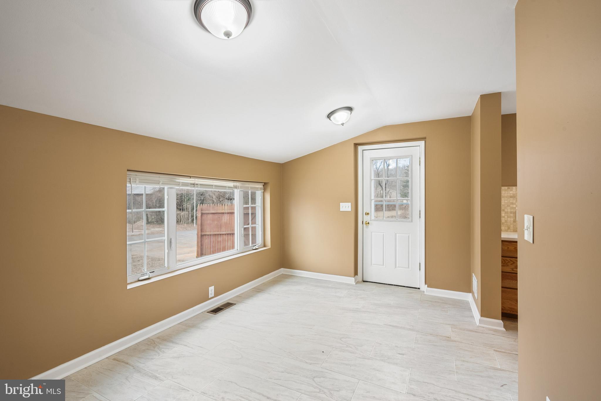 266 Bakers Basin Road Lawrence Township, NJ 08648 - Photo 23 of 32 a view of an empty room with a window