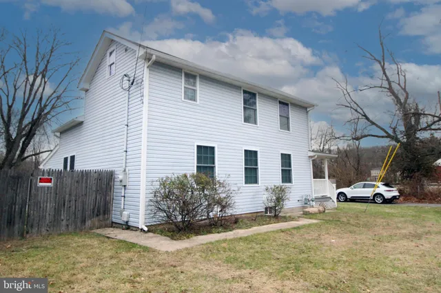 a view of a car park in front of house