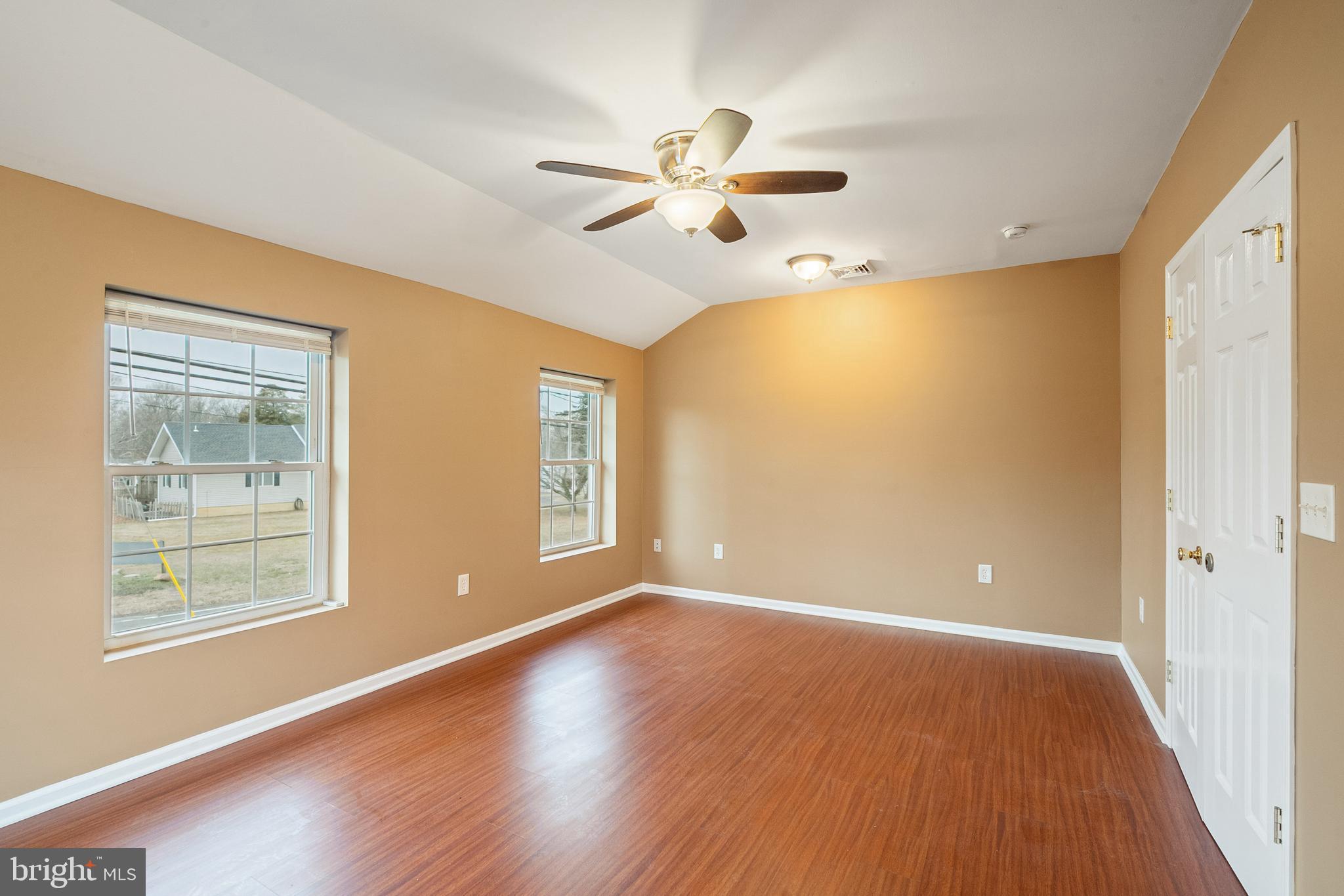 266 Bakers Basin Road Lawrence Township, NJ 08648 - Photo 31 of 32 a view of an empty room with a window and wooden floor