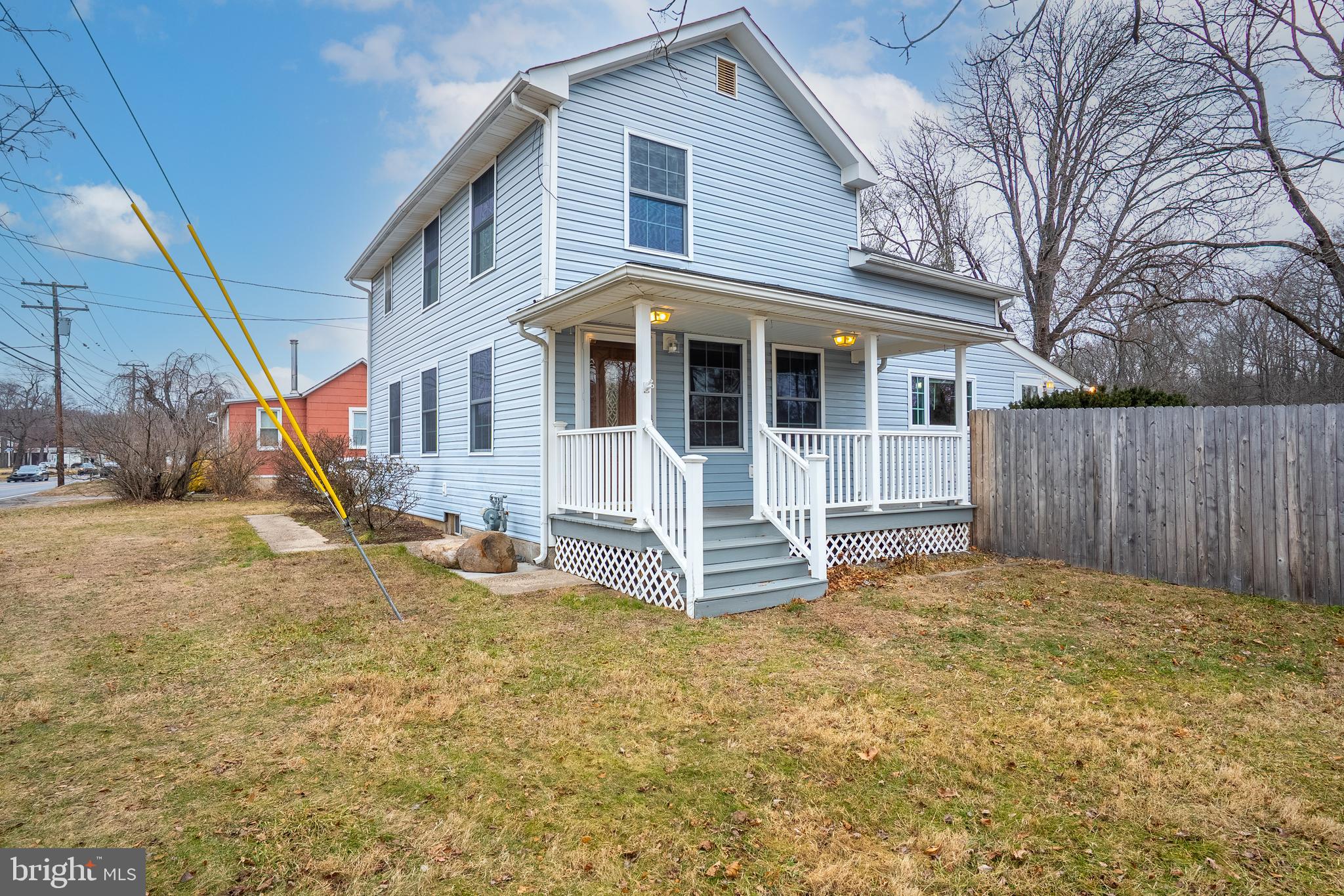 266 Bakers Basin Road Lawrence Township, NJ 08648 - Photo 4 of 32 a front view of a house with a yard