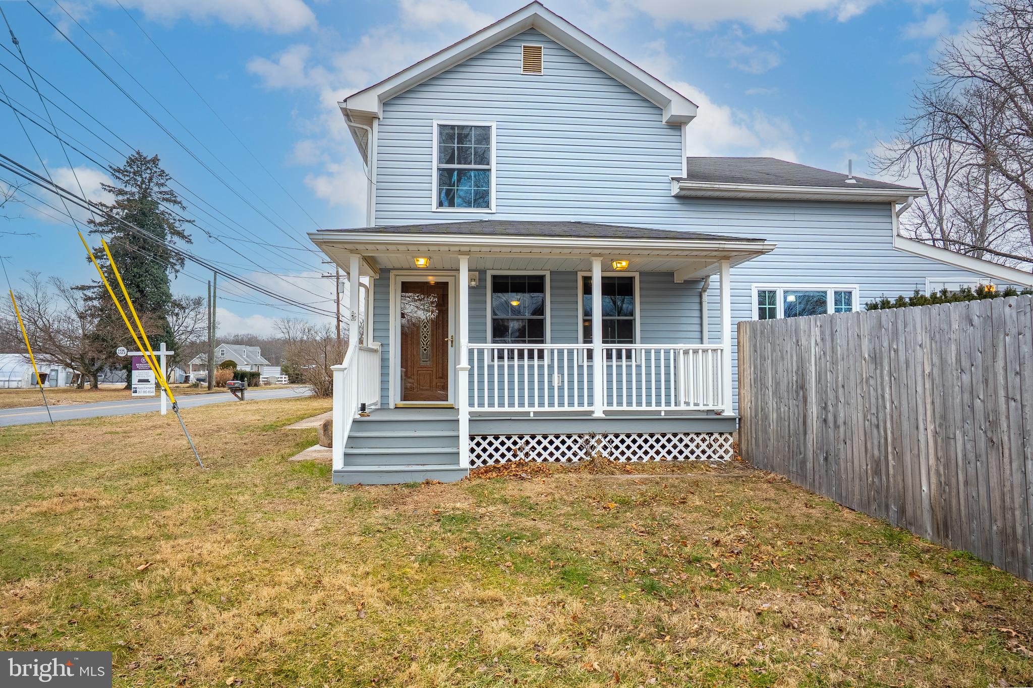 266 Bakers Basin Road Lawrence Township, NJ 08648 - Photo 5 of 32 a front view of a house with a garden