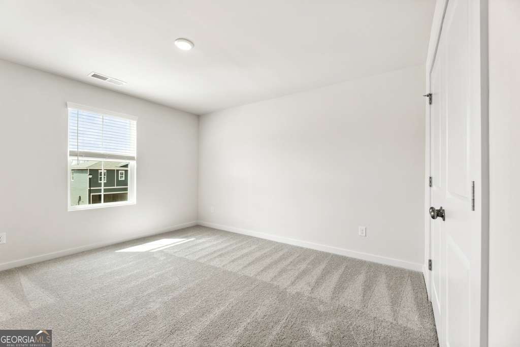 5420 Aurora Trail Flowery Branch, GA 30542 - Photo 16 of 38 an empty room with a window