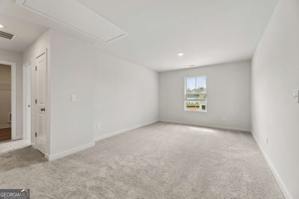 5420 Aurora Trail Flowery Branch, GA 30542 - Photo 22 of 38 an empty room with windows