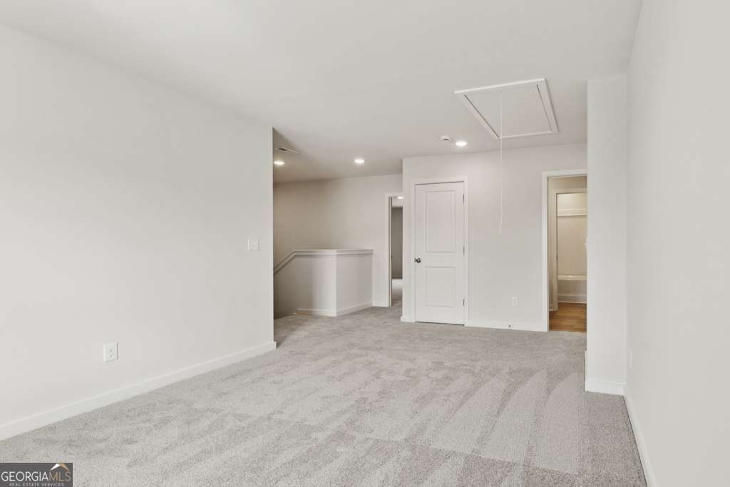 5420 Aurora Trail Flowery Branch, GA 30542 - Photo 23 of 38 a view of a livingroom and a bathroom