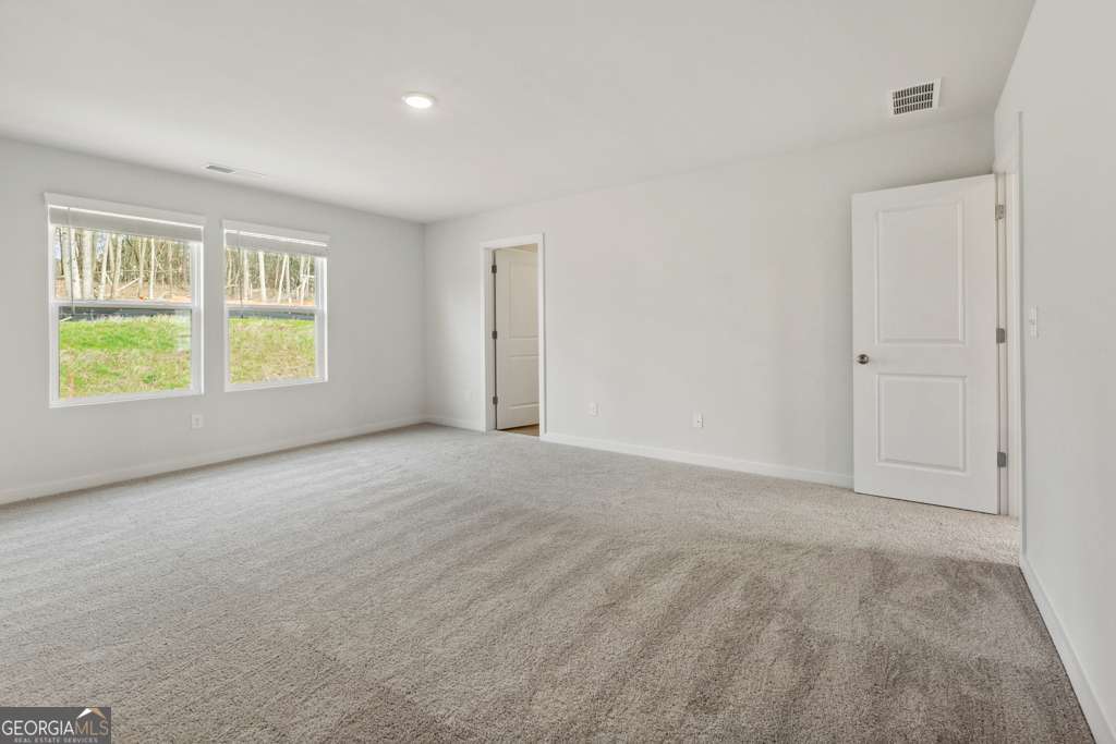 5420 Aurora Trail Flowery Branch, GA 30542 - Photo 25 of 38 a view of an empty room with a window