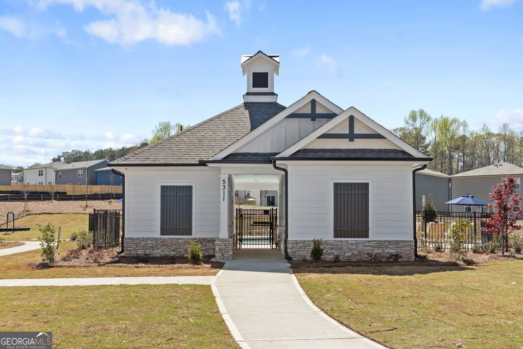 5420 Aurora Trail Flowery Branch, GA 30542 - Photo 35 of 38 a front view of a house with swimming pool