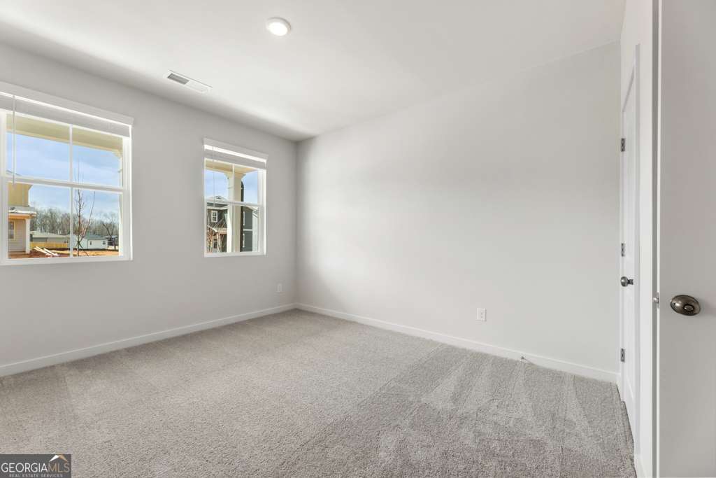 5420 Aurora Trail Flowery Branch, GA 30542 - Photo 5 of 38 an empty room with windows