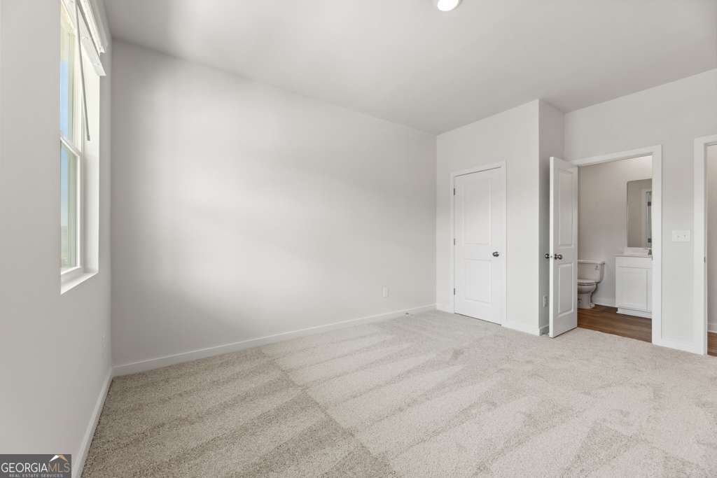 5420 Aurora Trail Flowery Branch, GA 30542 - Photo 6 of 38 an empty room with a bathroom