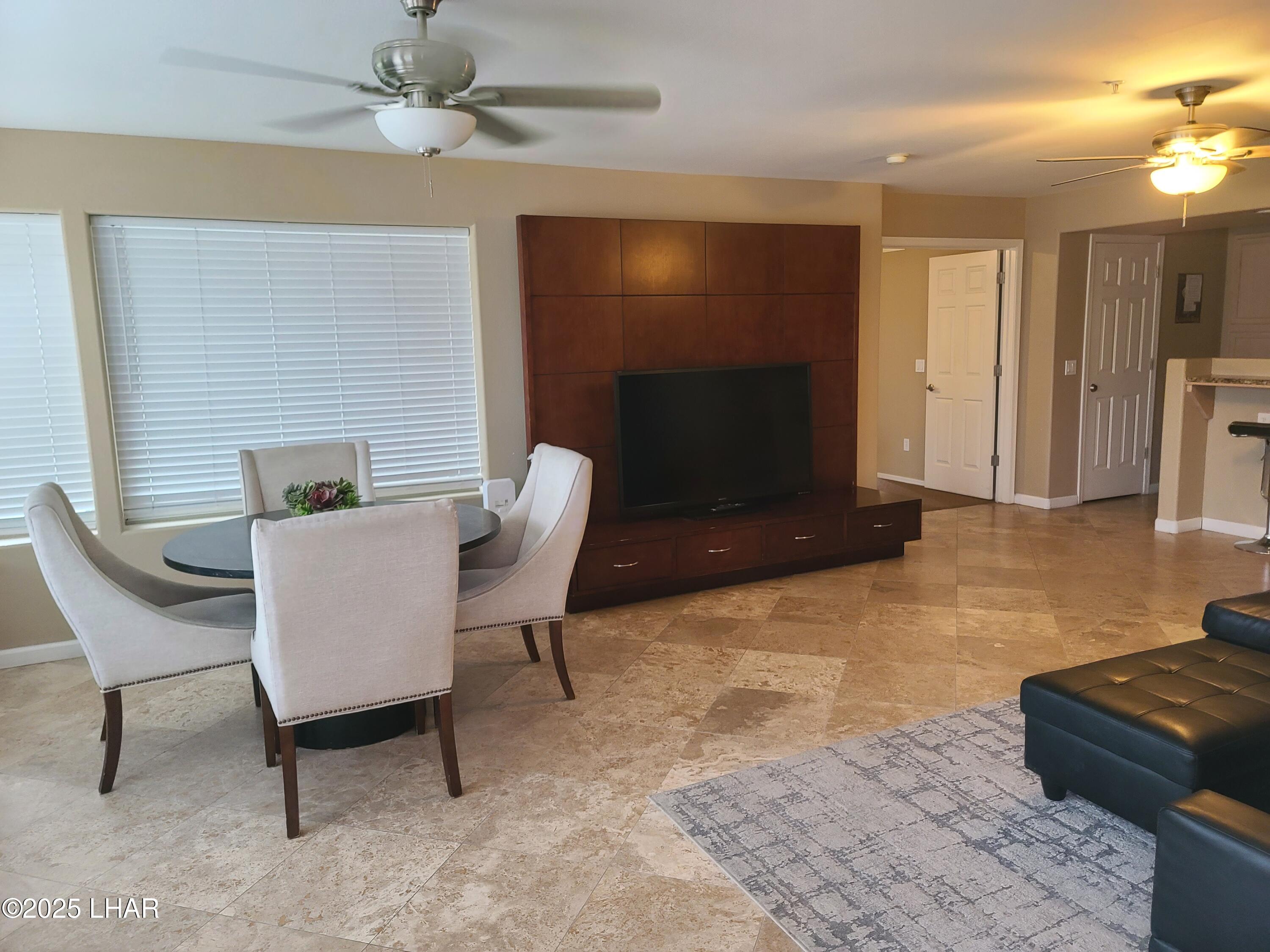 94 London Bridge Road, Unit 108 Lake Havasu City, AZ 86403 - Photo 12 of 38 a living room with furniture and a fireplace