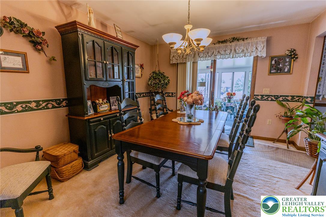 40 Locke Heights Road Bangor, PA 18013 - Photo 10 of 28 The dining room provides an elegant setting for meals with its classic chandelier and direct access to an enclosed porch.