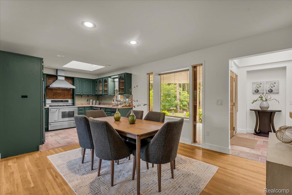1156 Seneca Road Lake Orion, MI 48362 - Photo 6 of 50 Dining room with a skylight, light wood finished floors, and recessed lighting
