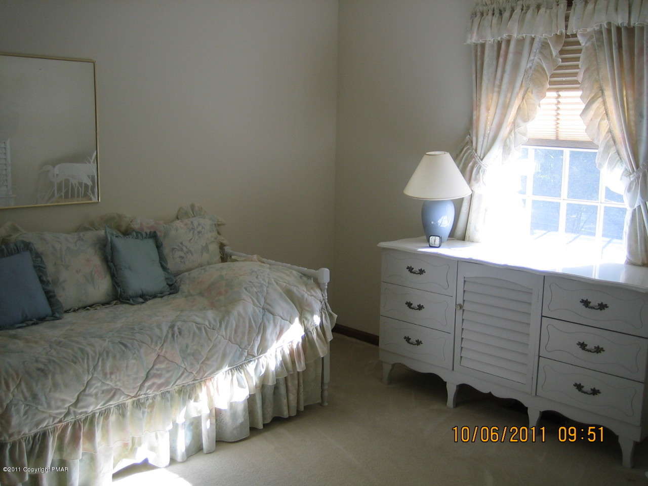 183 Koerners Road Cresco, PA 18326 - Photo 13 of 28 a spacious bedroom with a bed and a window