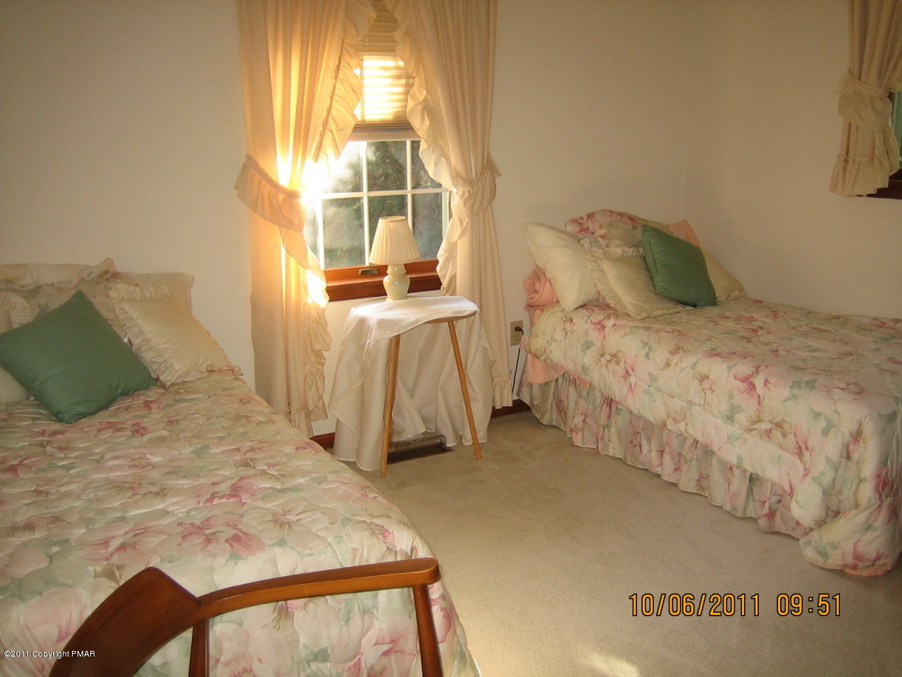183 Koerners Road Cresco, PA 18326 - Photo 14 of 28 a bedroom with a bed and a window