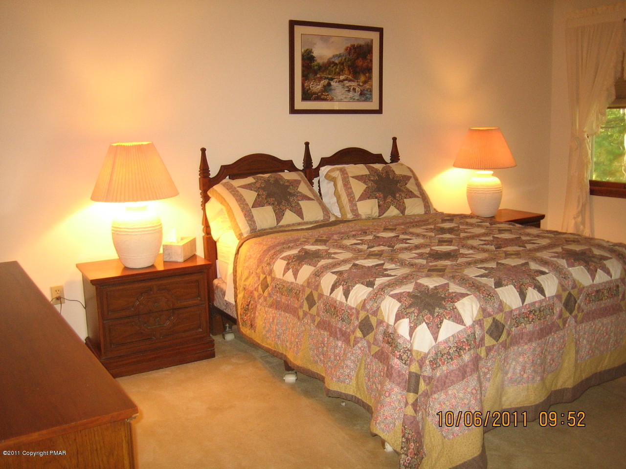 183 Koerners Road Cresco, PA 18326 - Photo 15 of 28 a bedroom with a bed and lamp