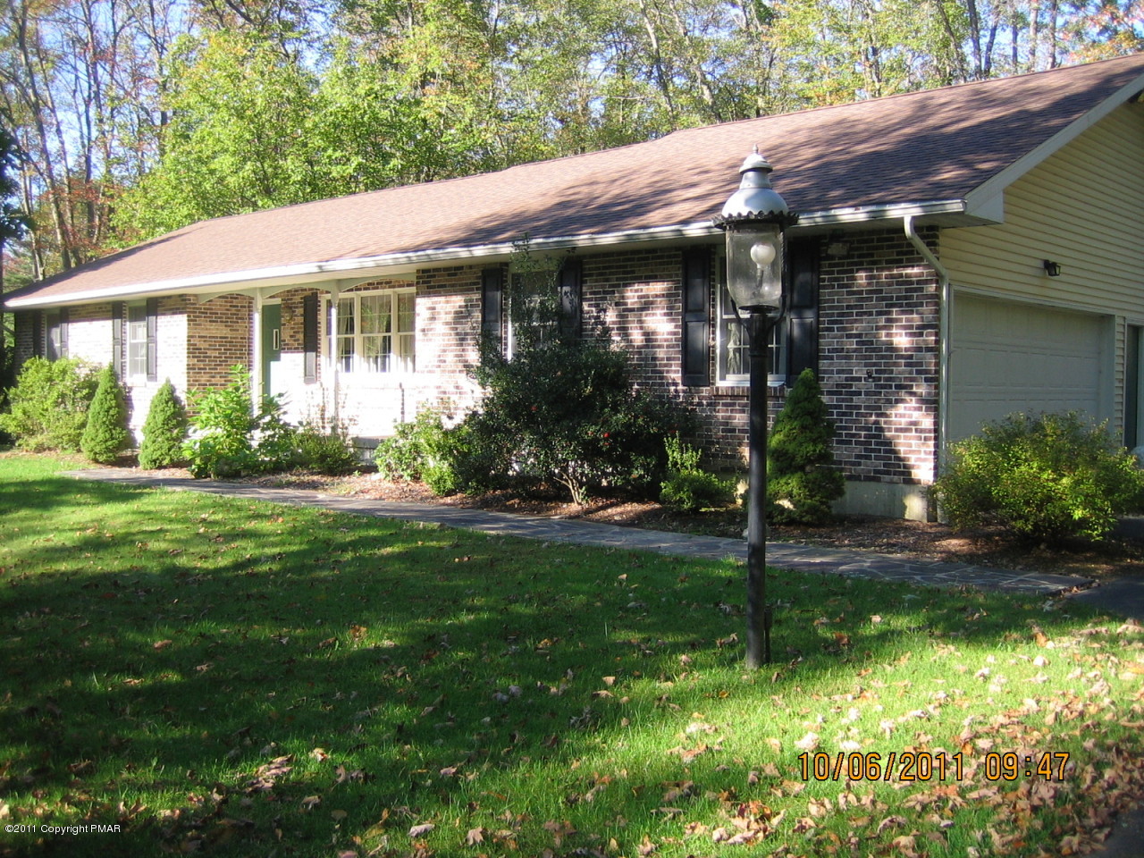 183 Koerners Road Cresco, PA 18326 - Photo 2 of 28 a view of a house with a yard plants and large tree