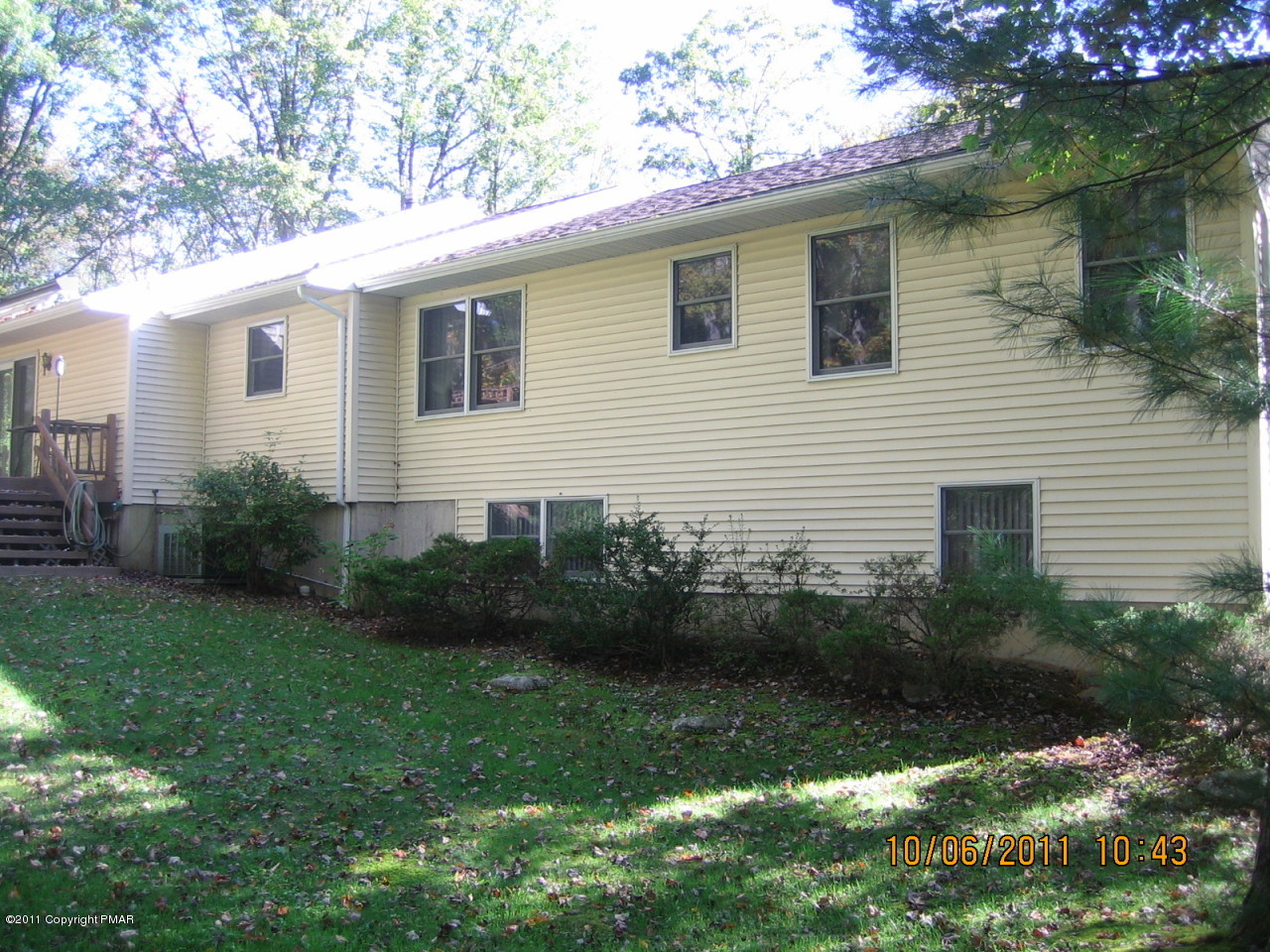 183 Koerners Road Cresco, PA 18326 - Photo 22 of 28 a view of backyard with potted plants and large tree