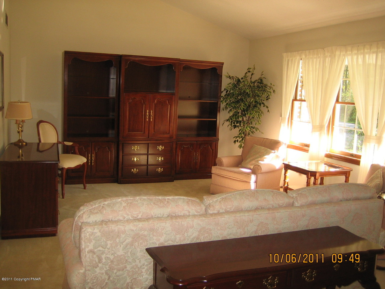 183 Koerners Road Cresco, PA 18326 - Photo 4 of 28 a living room with a bed furniture and a window