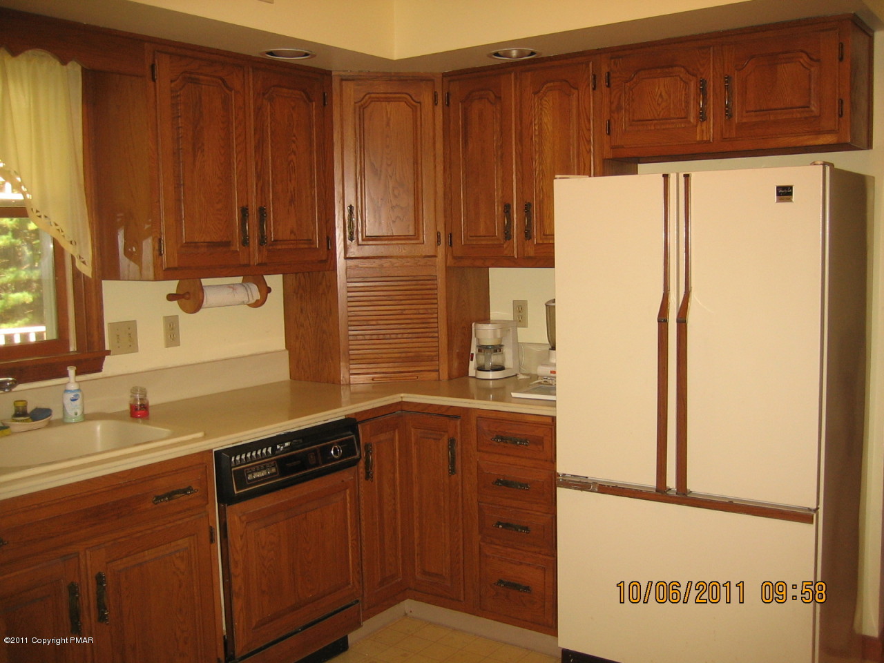 183 Koerners Road Cresco, PA 18326 - Photo 8 of 28 a kitchen with stainless steel appliances a refrigerator and a stove
