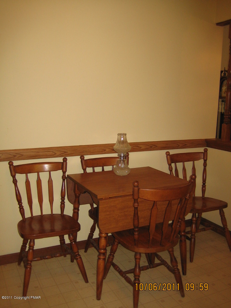 183 Koerners Road Cresco, PA 18326 - Photo 9 of 28 a balcony with table and chairs