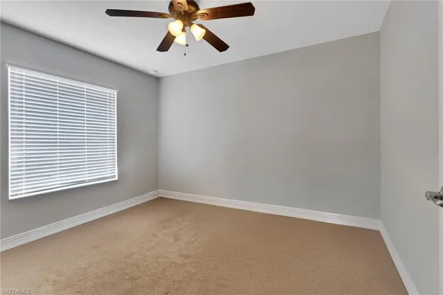 a bathroom with a granite countertop sink and a bathtub