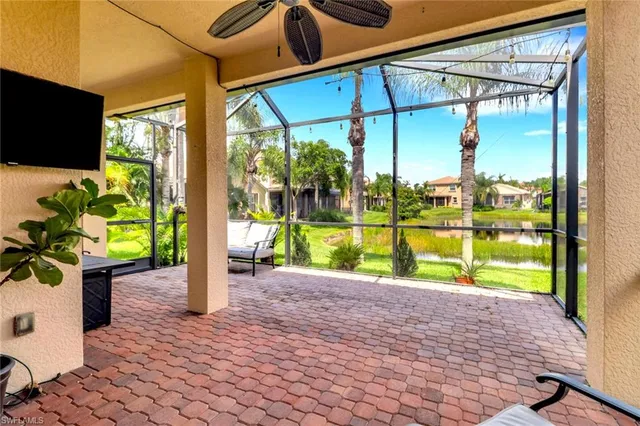 a view of a house with backyard and porch