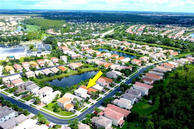 a living room with furniture a fireplace and a table
