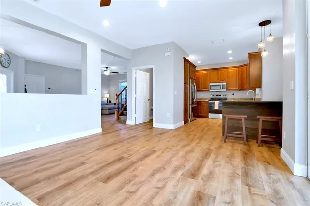 a view of a kitchen and dining room