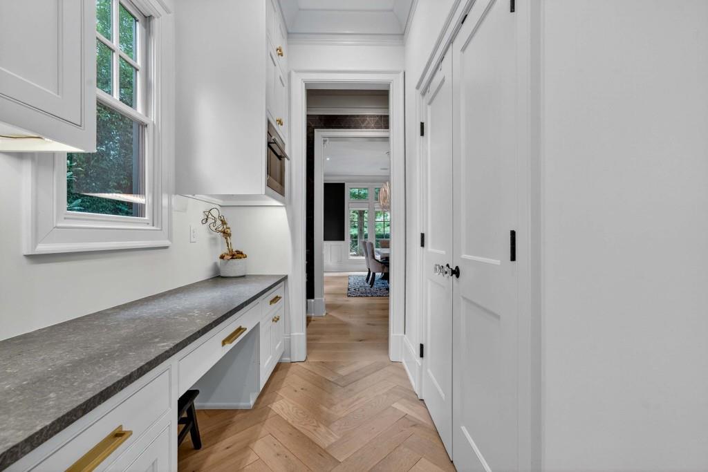 3303 Habersham Road Northwest Atlanta, GA 30305 - Photo 11 of 63 a large white kitchen with granite countertop a sink and dishwasher next to a window
