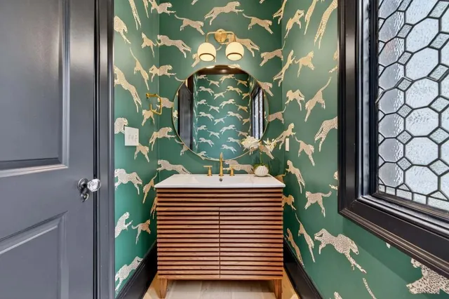 a bathroom with a toilet a sink and a mirror