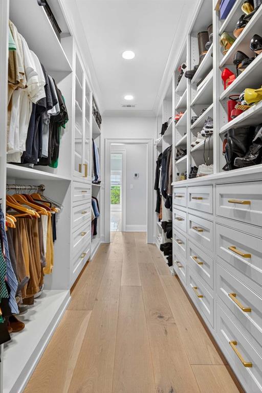 3303 Habersham Road Northwest Atlanta, GA 30305 - Photo 31 of 63 a view of walk in closet with clothes and shoes
