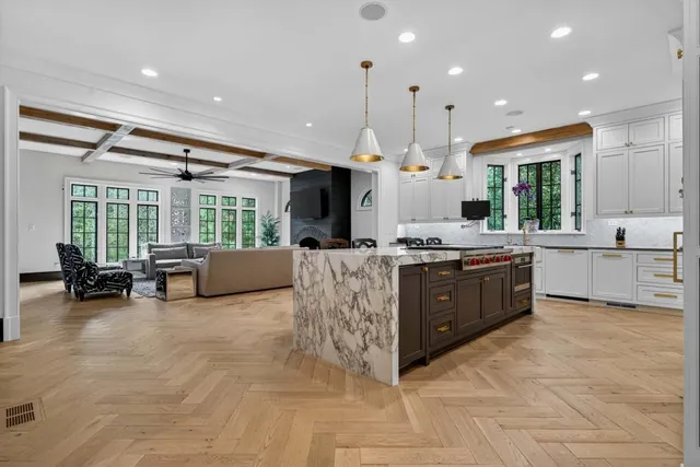 a large kitchen with lots of counter space and windows