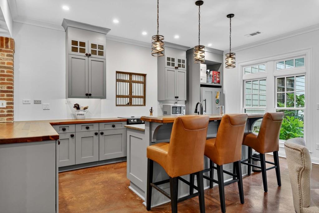 3303 Habersham Road Northwest Atlanta, GA 30305 - Photo 47 of 63 a large kitchen with a table and chairs
