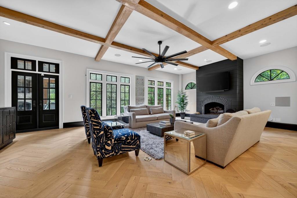 3303 Habersham Road Northwest Atlanta, GA 30305 - Photo 7 of 63 a living room with furniture fireplace and a flat screen tv