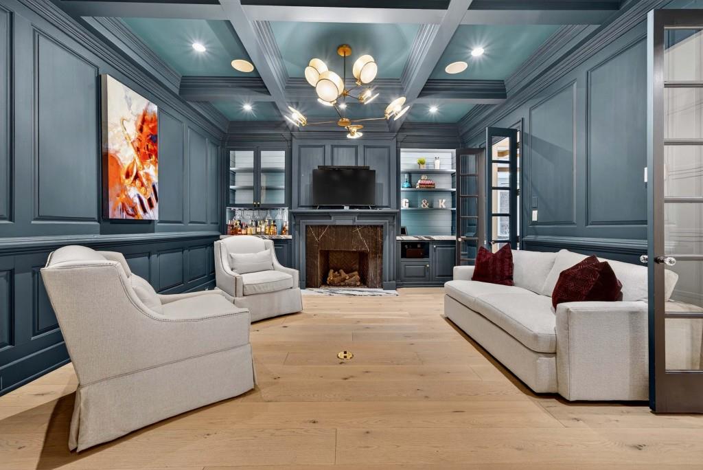3303 Habersham Road Northwest Atlanta, GA 30305 - Photo 10 of 63 a living room with furniture a flat screen tv and kitchen view