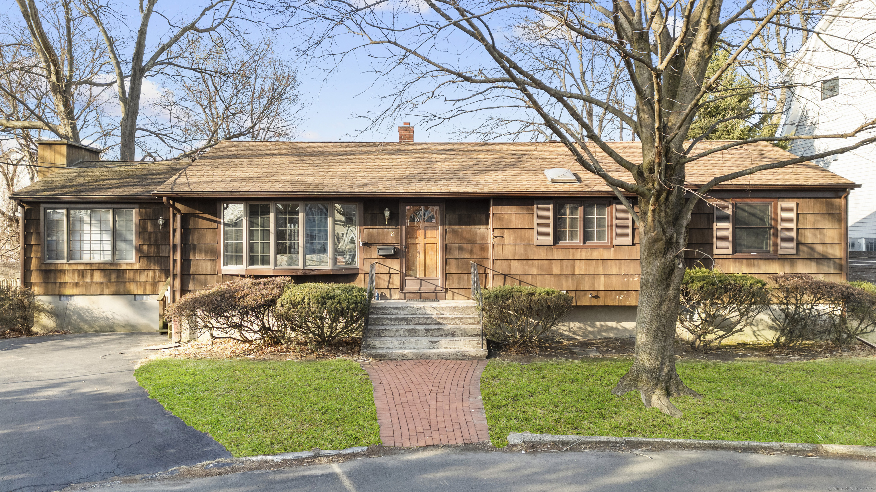 8 Millard Street Fairfield, CT 06824 - Photo 1 of 1 a front view of a house with garden