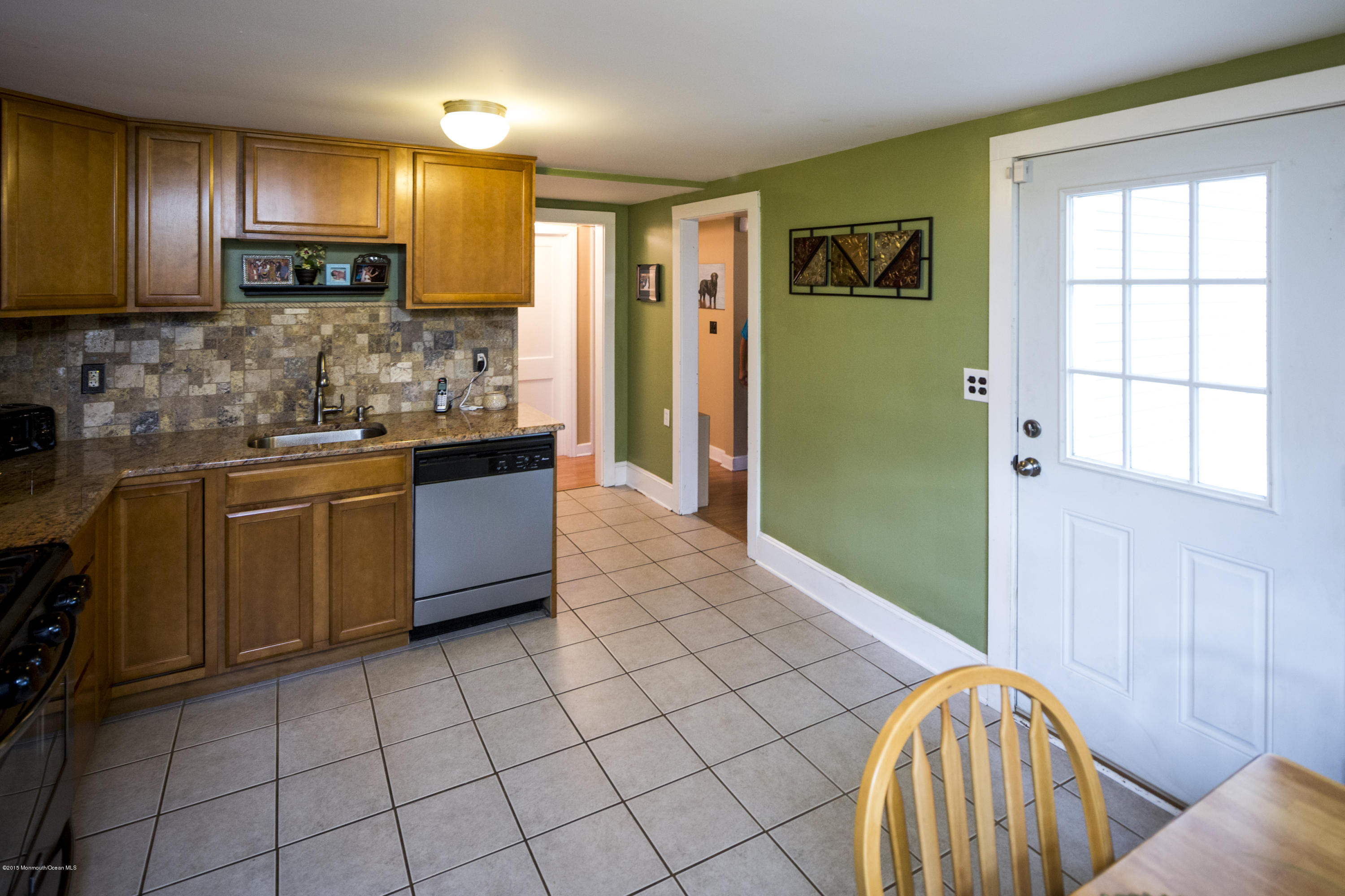 167 Newman Springs Road Tinton Falls, NJ 07724 - Photo 12 of 23 a kitchen with stainless steel appliances granite countertop a stove a sink and a microwave