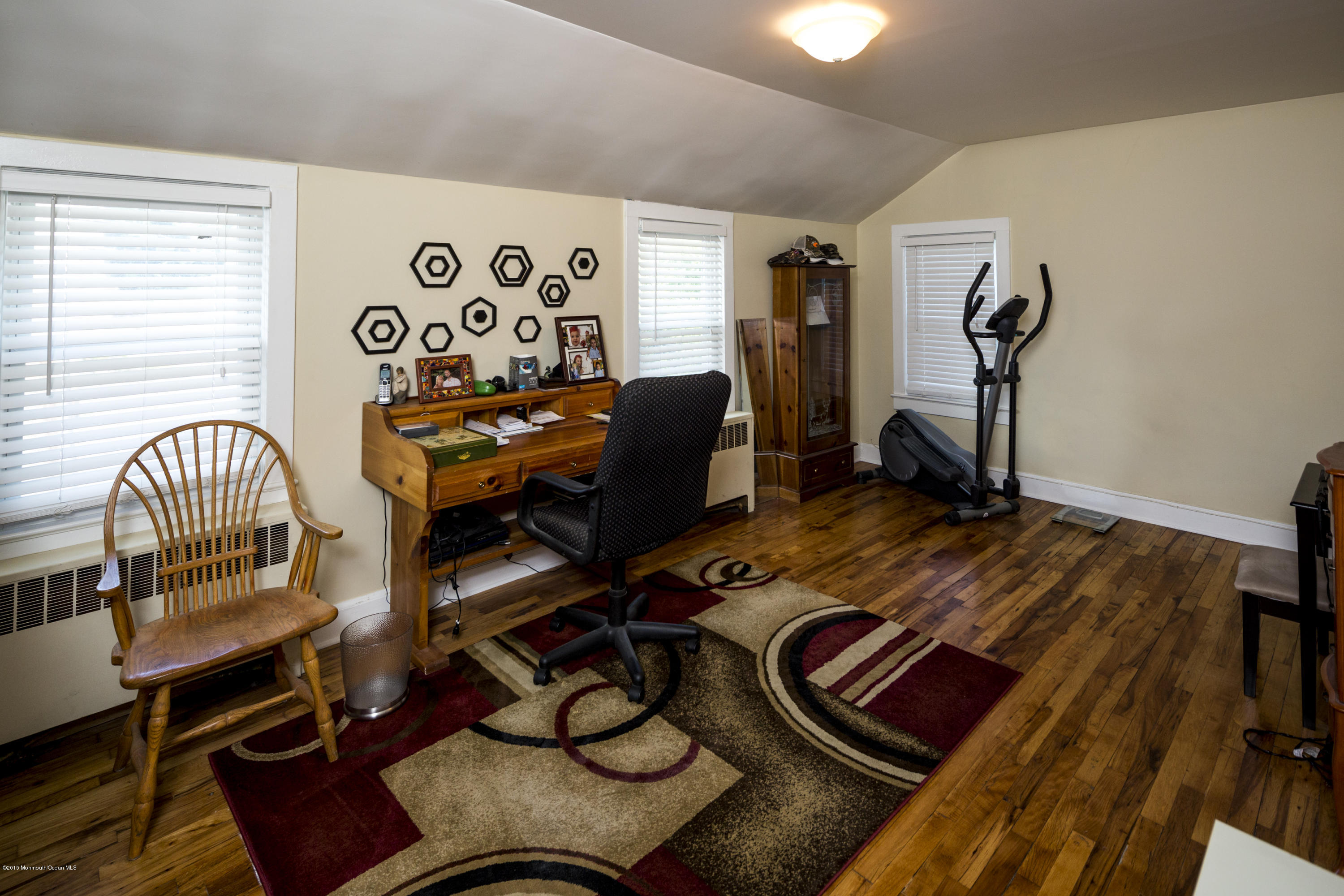 167 Newman Springs Road Tinton Falls, NJ 07724 - Photo 17 of 23 a bed room with a bed and a chair