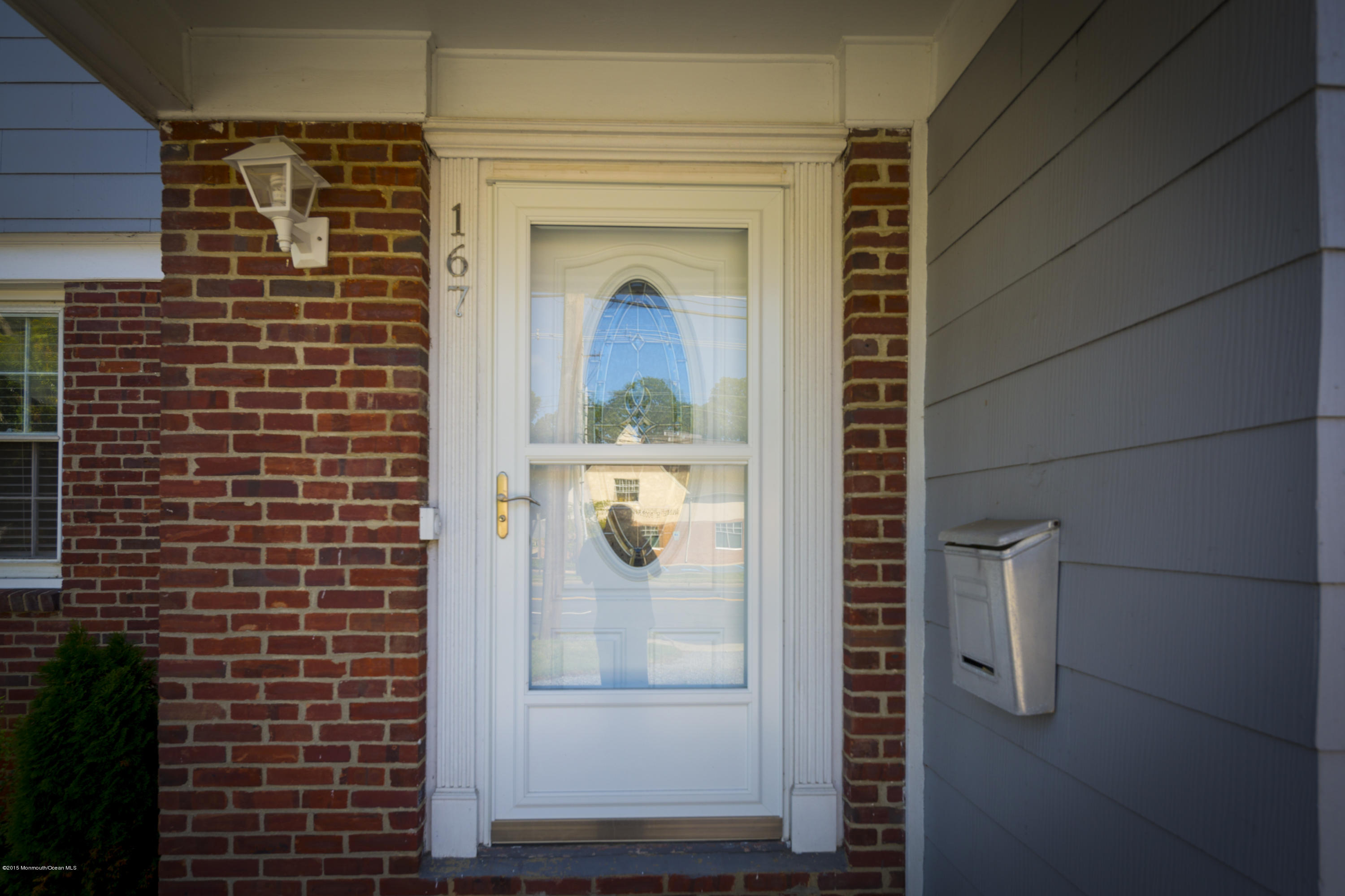 167 Newman Springs Road Tinton Falls, NJ 07724 - Photo 4 of 23 a view of a door and chair in a room